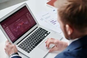 Clinic owner reviewing a Google Ads performance dashboard on a laptop