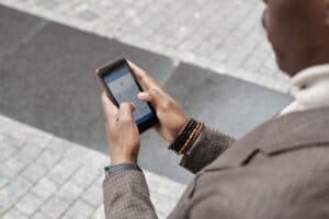 Person looking up a local business on a map app on their smartphone